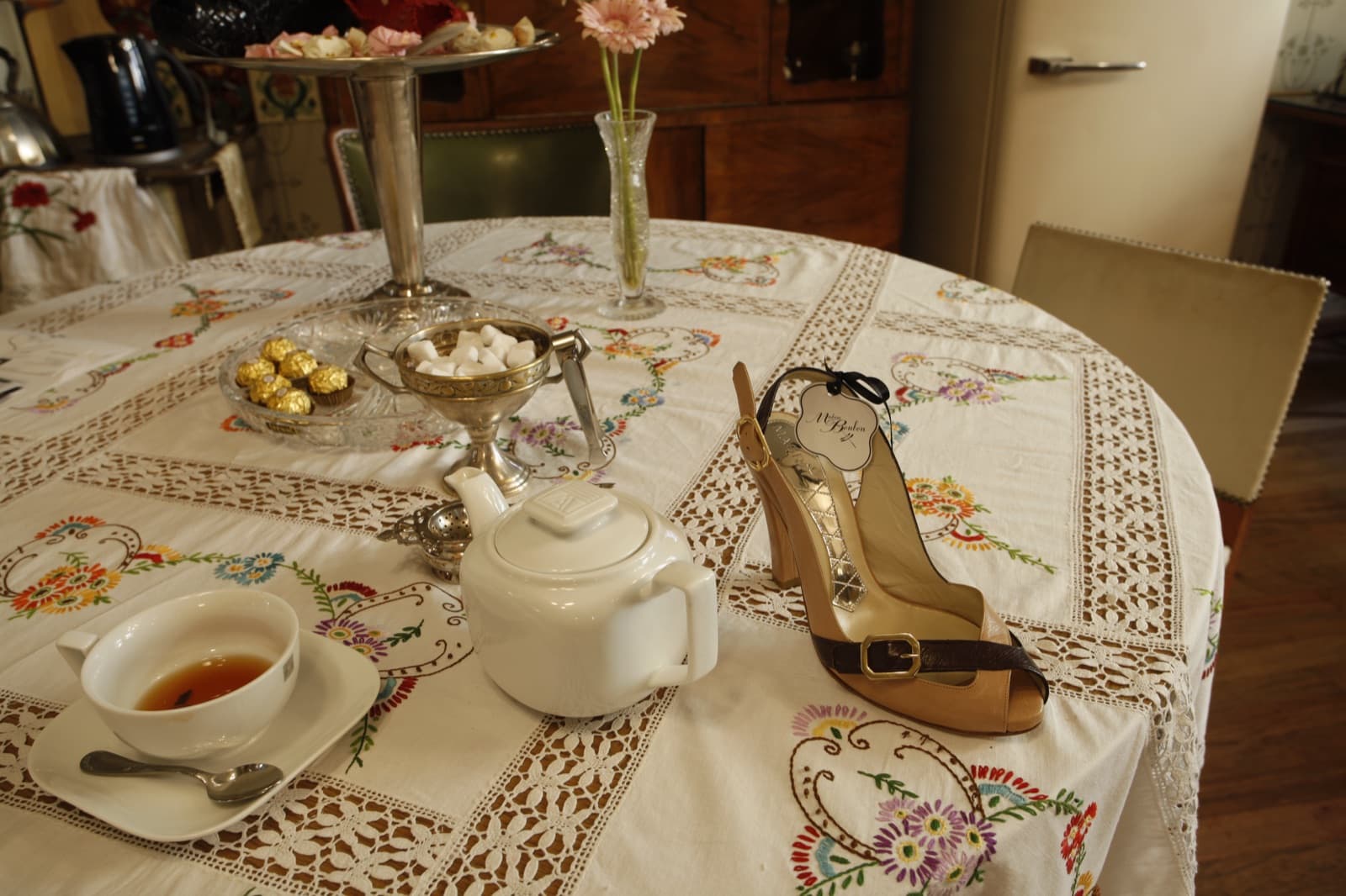 Designer heels displayed among vintage furniture at the early Madam Bonbon boutique